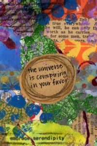 Scrapbook page with text The Universe is conspiring in your favor - embrace serendipity Lara Heacock