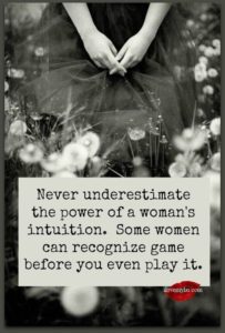 Woman seated on flowers see her hands with quote: Never Underestimate the power of a woman's intuition. Some women can recognize game before you even play it.